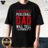 Alt Text: Original Warning Pickleball Dad Will Yell Loudly T-Shirt design featuring bold text on a casual tee for pickleball enthusiasts.