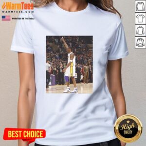 Pau Gasol wearing a Kobe Bryant ladies tee, showcasing his style and honoring the Lakers legend in a vibrant setting.