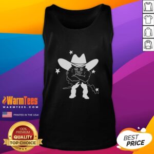 Alt Text: Medium build guy in a cowboy tank top, showcasing a unique style and confident demeanor against a casual background.