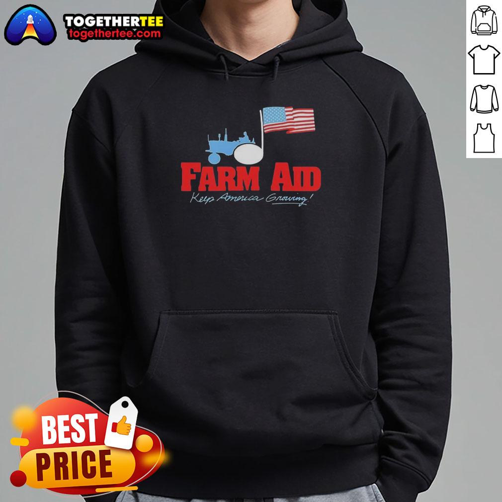 Premium Farm Aid Keep America Growing The Logo Of A Tractor And The American Flag Hoodie Alt Text: Premium Farm Aid hoodie featuring a tractor logo and American flag, symbolizing support for American farmers.