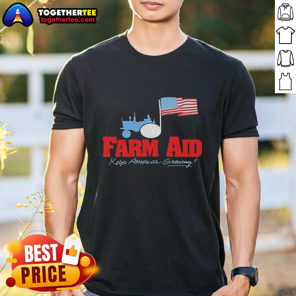 Premium Farm Aid Keep America Growing The Logo Of A Tractor And The American Flag T-Shirt Premium Farm Aid Keep America Growing t-shirt featuring a tractor and American flag logo.