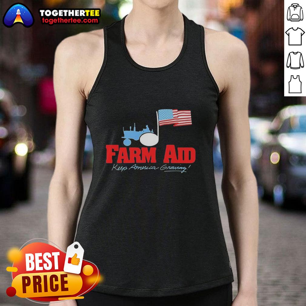 Premium Farm Aid Keep America Growing The Logo Of A Tractor And The American Flag Tank Top Alt Text: Premium Farm Aid tank top featuring a tractor logo and the American flag, promoting the Keep America Growing initiative.