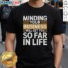 Premium vintage T-shirt featuring 'Minding Your Own Business Will Take You Very Far In Life' motivational quote design.