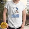 Alt Text: Premium Snoopy X Los Angeles Dodgers World Champs Cartoon T-Shirt featuring Snoopy celebrating Dodgers victory.