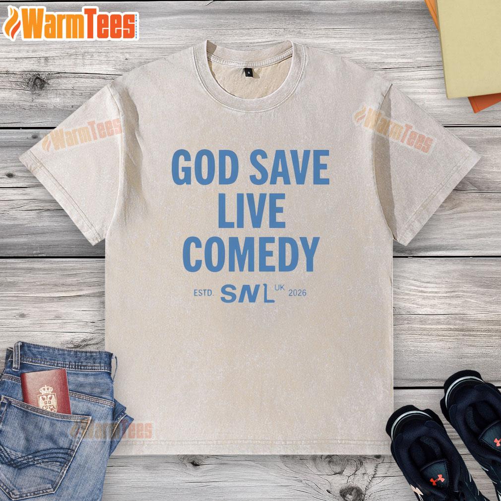 pretty-god-save-live-comedy-snl-uk-estd-2026-washed-t-shirt Pretty God Save Live Comedy SNl UK Estd 2026 washed t-shirt displayed on a hanger in a bright setting.