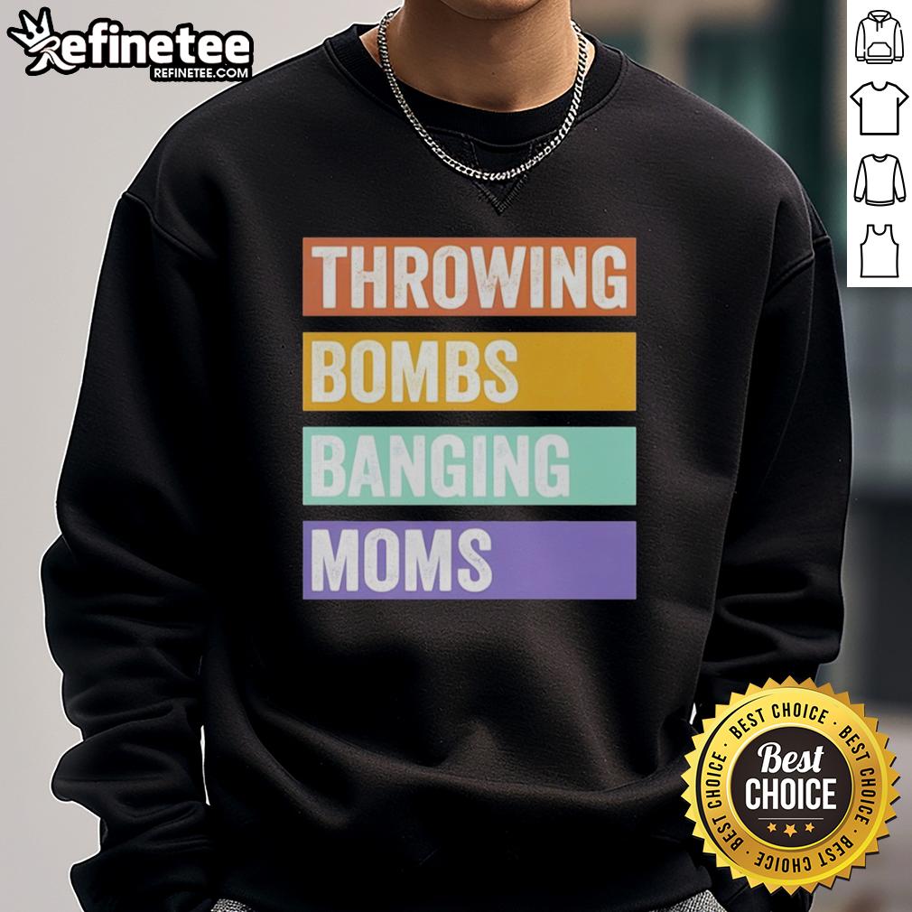 pretty-throwing-bombs-banging-moms-retro-sweatshirt Pretty Throwing Bombs Banging Moms retro sweatshirt displayed on a wooden background, showcasing its vibrant design.