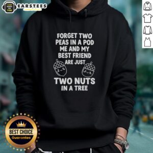 Two friends wearing matching 'Two Nuts in a Tree' hoodies, showcasing friendship and fun in a vibrant outdoor setting.
