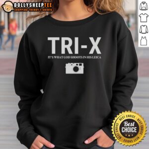 Nice Tri-X Its What God Shoots In His Leica Sweatshirt displayed on a wooden background, showcasing stylish photography apparel.