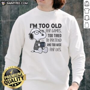 Alt Text: Cozy sweatshirt featuring Snoopy with the phrase Too Old for Games, Too Tired to Pretend for a relaxed vibe.
