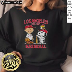 Charlie Brown, Snoopy, and Woodstock wearing a Los Angeles Angels baseball jersey sweatshirt, established 1961.