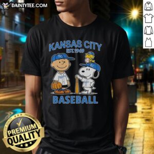 Alt Text: Charlie Brown, Snoopy, and Woodstock wearing Kansas City Royals baseball jersey Est 1969 on a stylish t-shirt.