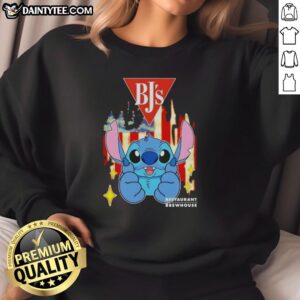 Alt Text: Cute Stitch-like BJ's Restaurants USA flag sweatshirt featuring vibrant colors and cozy design for fans.