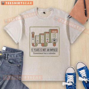 Good 15 Years Is Not An Impulse Washed T-Shirt displayed on a hanger, showcasing unique design and quality fabric.