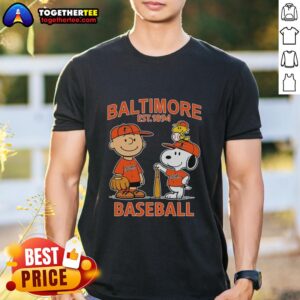 Charlie Brown, Snoopy, and Woodstock wearing Baltimore Orioles jersey on a fun t-shirt, celebrating the team's legacy since 1894.