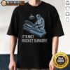 Top It'S Not Rocket Surgery T-Shirt featuring a humorous design, perfect for casual wear and science enthusiasts.