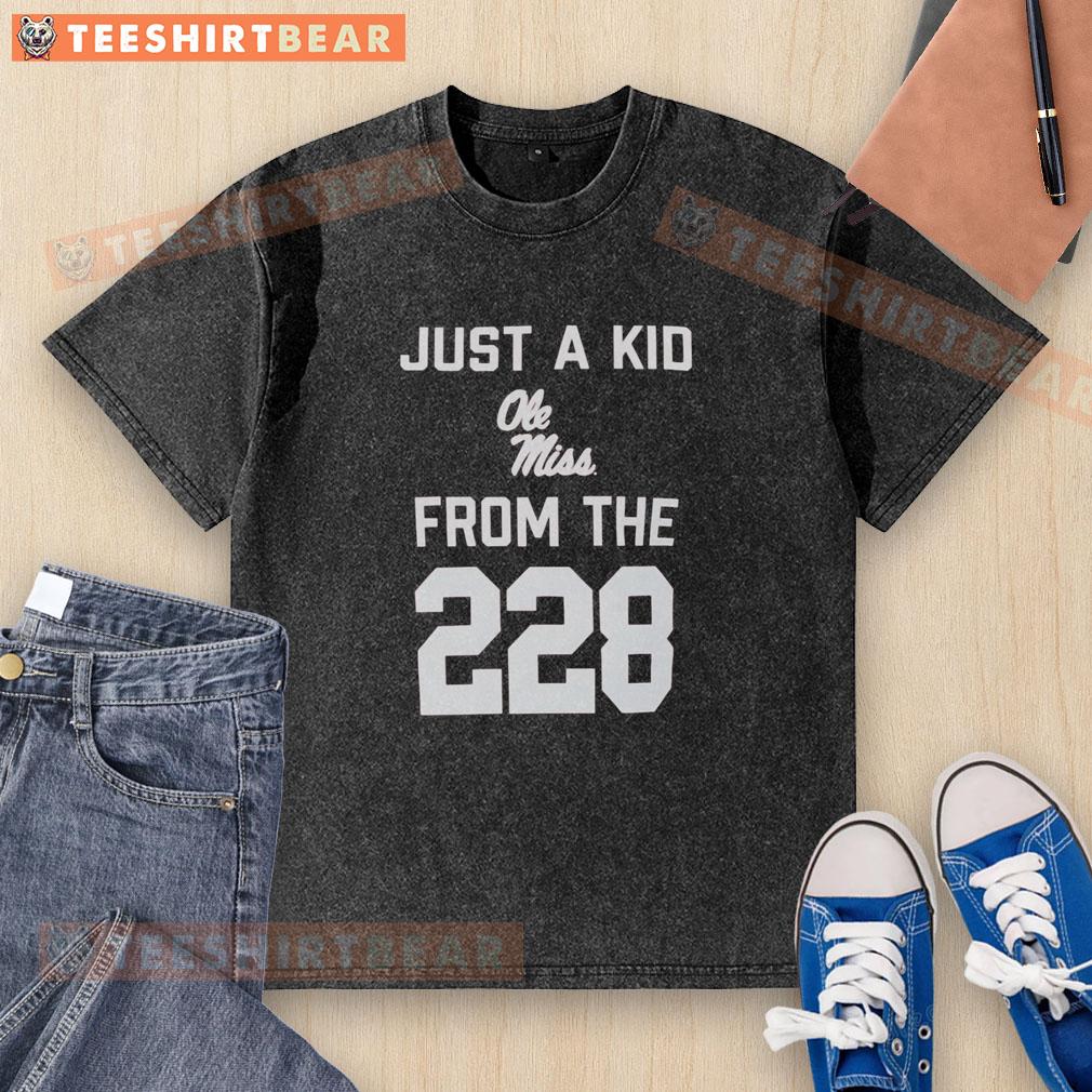 top-just-a-kid-ole-miss-from-the-228-washed-t-shirt Top Just A Kid Ole Miss From The 228 washed t-shirt displayed on a rustic wooden background, showcasing its vibrant design.