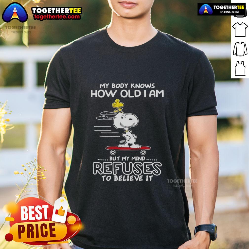 Top Snoopy Woodstock My Body Knows How Old I Am But My Mind Refuses To Believe It T-Shirt Top Snoopy Woodstock T-Shirt: 'My Body Knows How Old I Am But My Mind Refuses To Believe It' design for fun, casual wear.