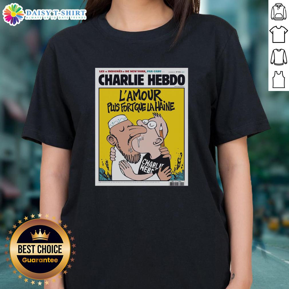 Top Two Men Kissing Charlie Hebdo L’Amour Plus Fort Que La Haine Ladies Tee Two men kissing in a heartfelt moment, inspired by Charlie Hebdo's L'Amour Plus Fort Que La Haine, featured on a ladies tee.