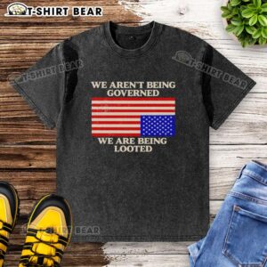Awesome We Aren't Being Governed We Are Being Looted washed t-shirt featuring bold text on a casual fit design.