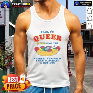 Person wearing a 'Nice Yeah, I'm Queer' tank top, searching for a hot dog vendor at a vibrant outdoor market.