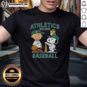 Alt Text: Charlie Brown, Snoopy, and Woodstock wearing Oakland Athletics baseball jersey t-shirt established 1901.