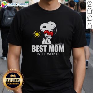 Hot Snoopy hugging a heart on a 'Best Mom In The World' T-shirt, perfect gift for moms who love Peanuts characters.
