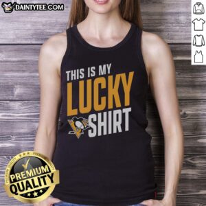 Alt Text: Fan wearing an Awesome Pittsburgh Penguins tank top, showcasing team spirit and luck at a hockey game.
