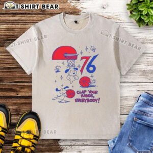 Premium Philadelphia 76ers X Snoopy and Woodstock 'Clap Your Hands Everybody' washed t-shirt featuring vibrant graphics.