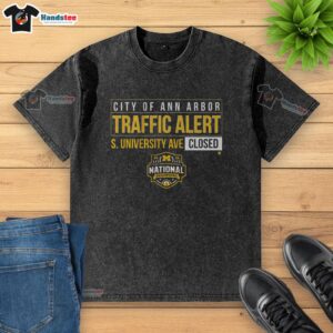 Nice Michigan Wolverines MBB 2026 National Champions S. University Ave Closed Washed T-Shirt displayed on a hanger.