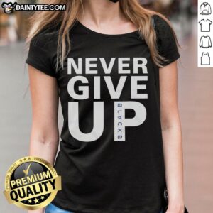 Alt Text: Mohamed Salah wearing a Never Give Up ladies tee, showcasing his inspiring style and determination on and off the field.