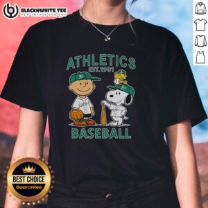 Alt Text: Charlie Brown, Snoopy, and Woodstock on a ladies tee featuring Oakland Athletics baseball jersey, est. 1901.