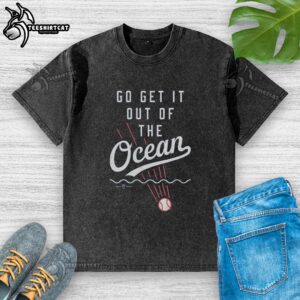 Pretty Go Get It Out Of The Ocean washed t-shirt displayed on a sandy beach, perfect for casual summer wear.