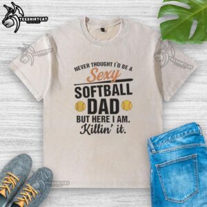 Cool dad wearing a 'Hot Never Thought I'd Be A Sexy Softball Dad' washed t-shirt, showcasing pride in his sporty style.