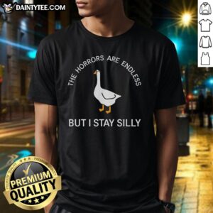 Alt Text: Pretty The Horrors Are Endless But I Stay Silly T-Shirt featuring bold text design on a casual tee.