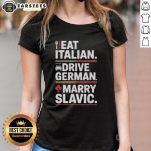 Women in a car wearing 'Awesome Eat Italian Drive German Marry Slavic Balkan Wife' tees, celebrating European culture.