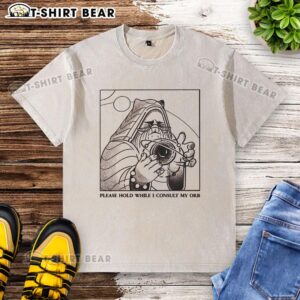 Official Please Hold While I Consult My Orb washed t-shirt featuring a whimsical design for casual wear enthusiasts.