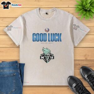 Alt Text: Official New York Islanders Good Luck New York Liberty washed t-shirt featuring team logos and stylish design.