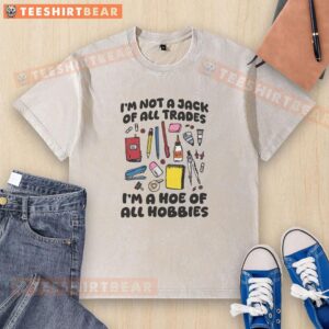 Pretty I'm Not A Jack Of All Trades I'm A Hoe Of All Hobbies washed t-shirt displayed on a wooden background.