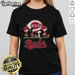 Snoopy, Charlie Brown, Linus, and Lucy in Cincinnati Reds baseball jerseys on a ladies' tee shirt design.