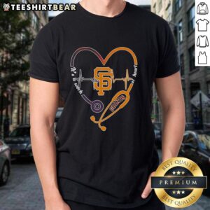 Premium San Francisco Giants T-shirt featuring heartbeat design and 'It's A Work Of Heart' slogan for fans and healthcare workers.