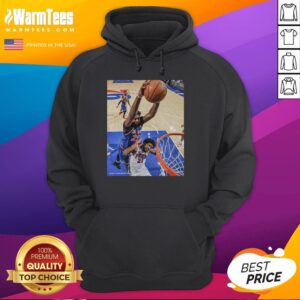 Joel Embiid in a stylish Philadelphia 76ers hoodie, showcasing his passion for basketball and team spirit.