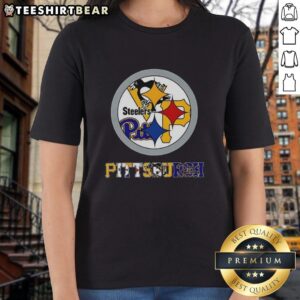 Stylish ladies tee featuring the Pittsburgh Steelers NFL logo and iconic Pittsburgh sports team logos.