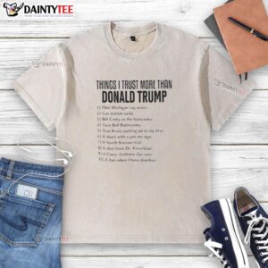 Anti-Trump washed T-shirt featuring the phrase 'Top Things I Trust More Than Donald Trump' in bold, eye-catching design.