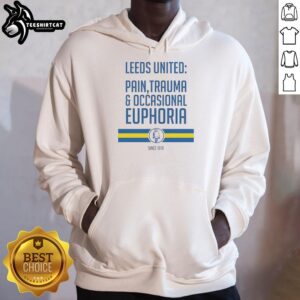 Official Leeds United hoodie featuring 'Pain, Trauma, and Occasional Euphoria Since 1919' design in club colors.