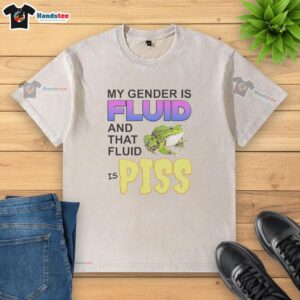 Colorful 'My Gender Is Fluid And Tha Fluid Is Piss' frog graphic t-shirt showcasing unique gender expression and humor.