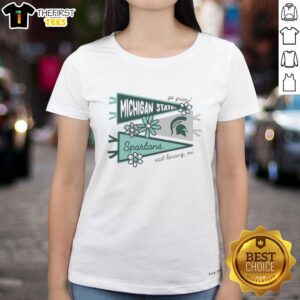 Awesome Michigan State Spartans flags displayed on a ladies tee in East Lansing, MI, perfect for fans and game day.