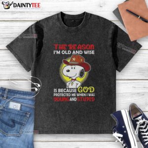 Alt Text: Good Cowboy Snoopy t-shirt with 'The reason I'm old and wise is God protected me when I was young and stupid' design.