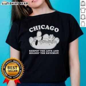 Alt Text: Top Chicago Snoopy 'Keepin The Love and Holdin The Ketchup' ladies tee featuring vibrant graphic design.