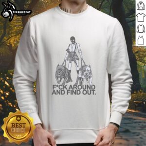 Pretty girl wearing a balaclava mask, walking two dogs in a 'Fuck Around and Find Out' sweatshirt.