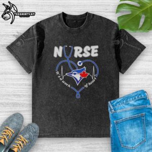 Alt Text: Premium Toronto Blue Jays Nurse 'It's A Work Of Heart' washed t-shirt in blue, perfect for baseball fans and healthcare workers.